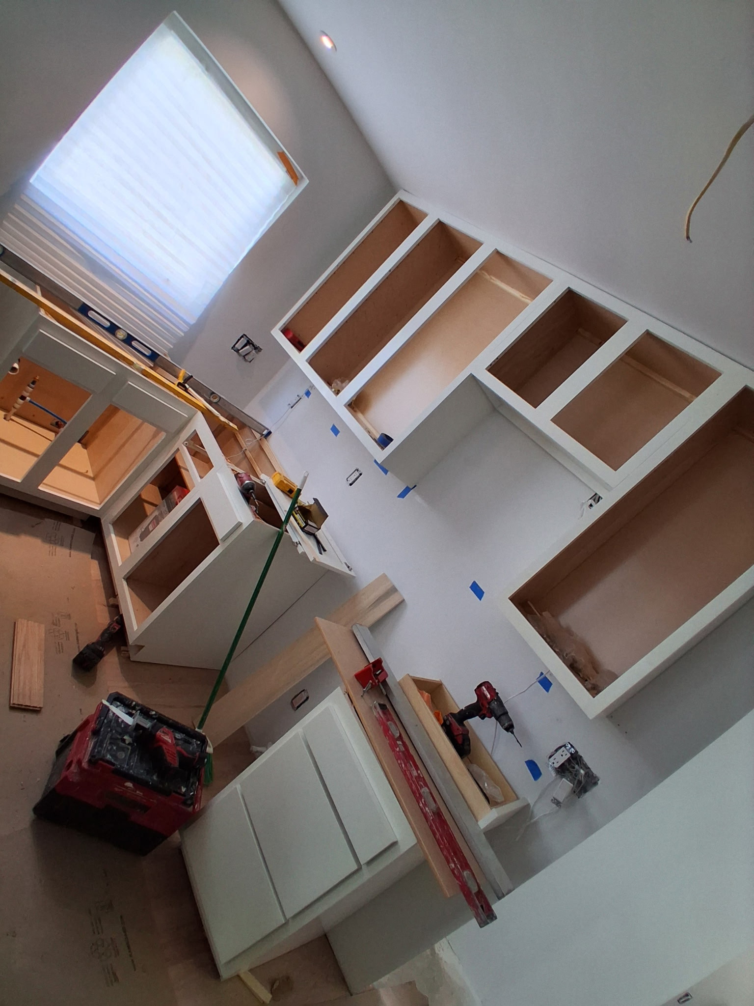 Cabinet Installation with Worker